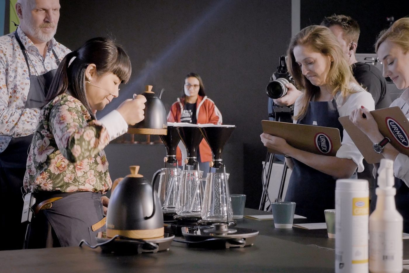 Barista preparing coffee on GINA smart brewing instrument