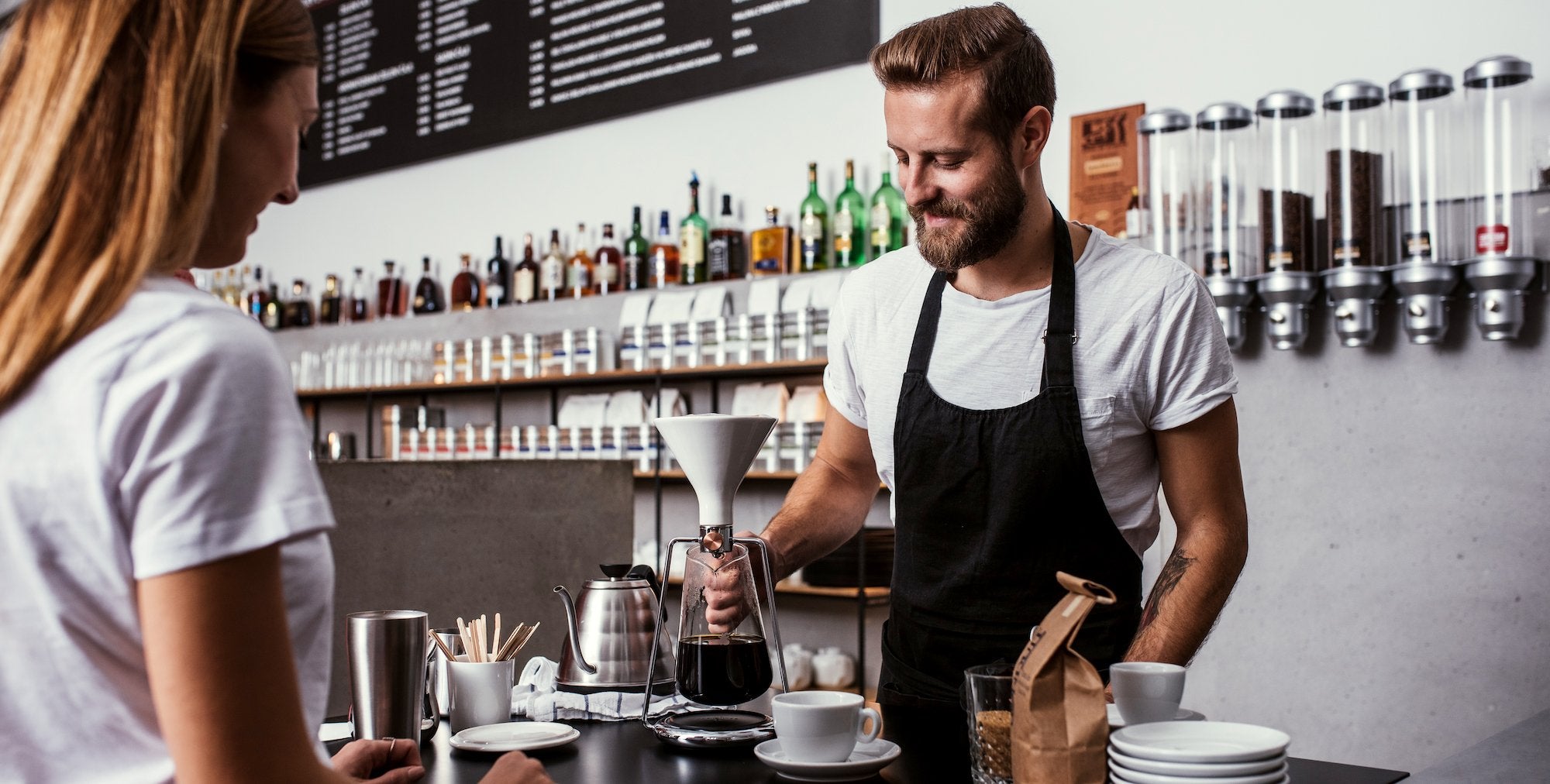 Barista preparing coffee on GINA smart brewing instrument